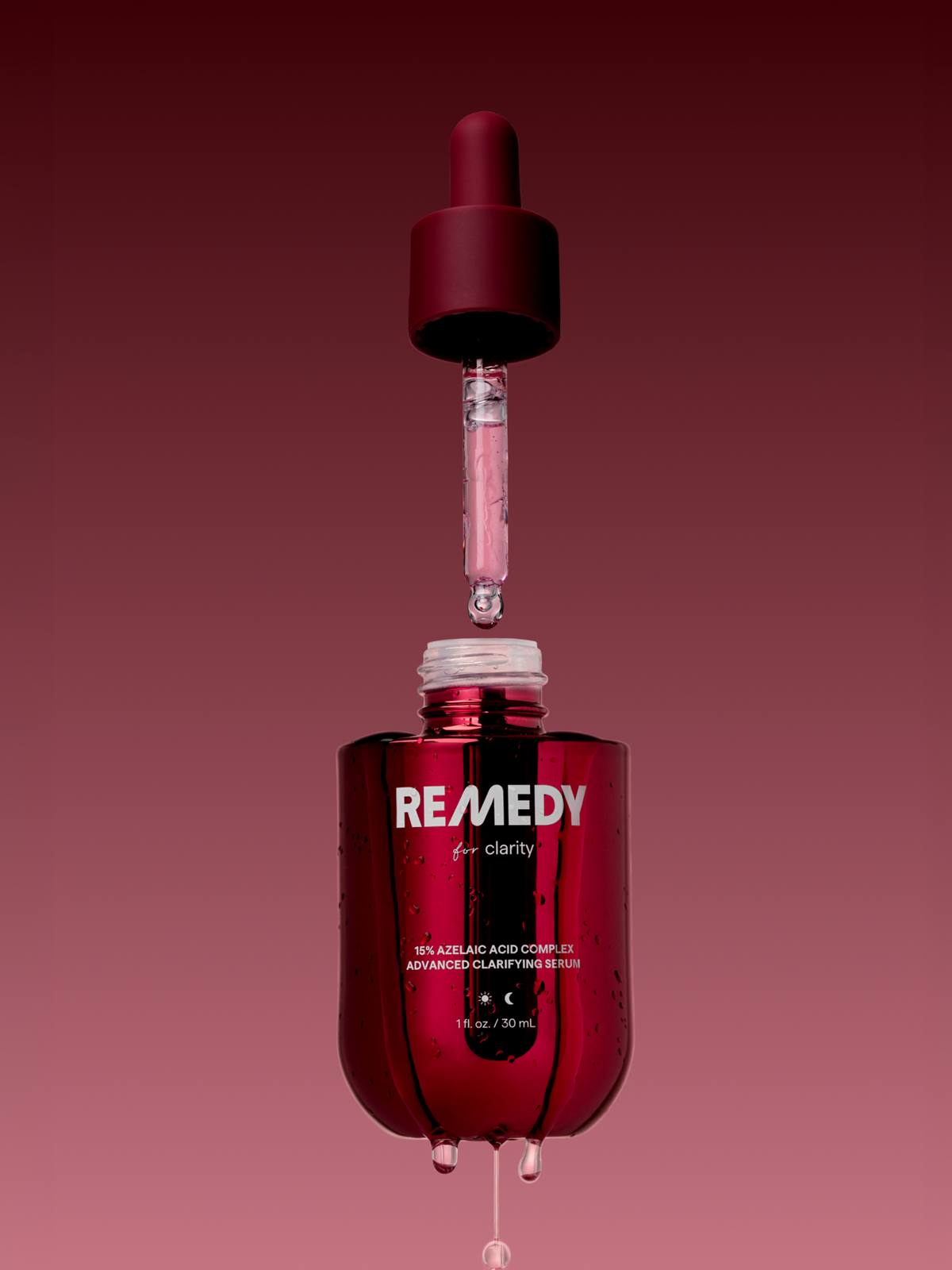 Woman in profile holding the Remedy 15% Azelaic Acid Complex serum